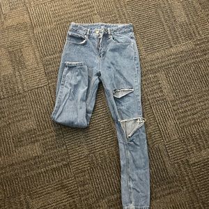 SHEIN light wash Women’s ripped boyfriend jeans.